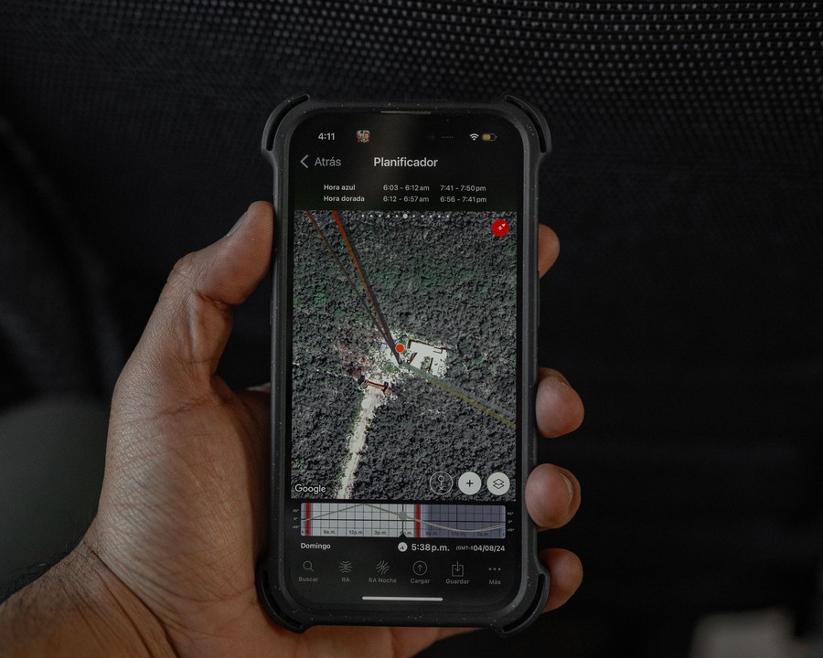 Satellite map interface on a smartphone in hand